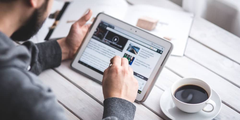 Nan looking at tablet screen to accompany blog article: Time to follow a more employee-centric approach to skills management?